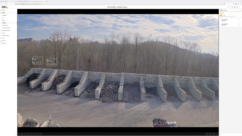 Live camera feed of outdoor bulk material storage bays with overlaid LiDAR-generated volume data showing real-time fill levels for each bay.