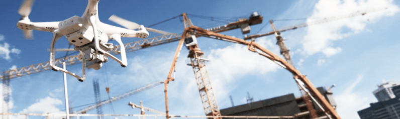 drone with sensor overseeing a construction site